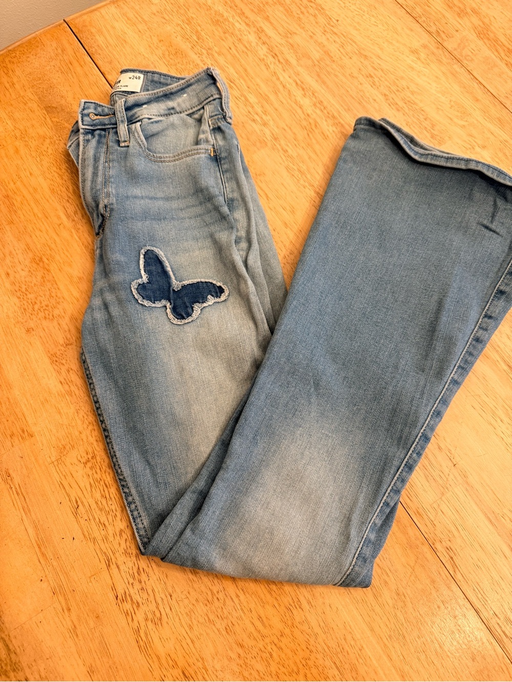 Hollister Light Blue Skinny Jeans with Dark Blue Butterfly Patch